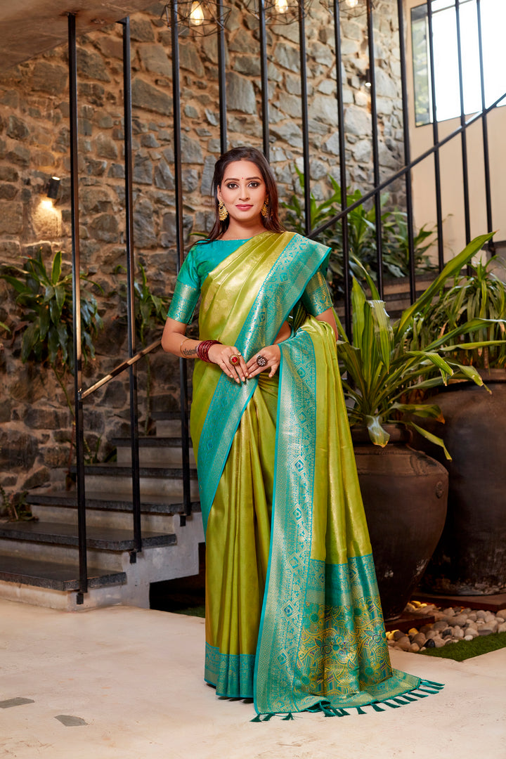 Classic olive Tissue silk saree with intricate weaving and a vibrant contrast border design.