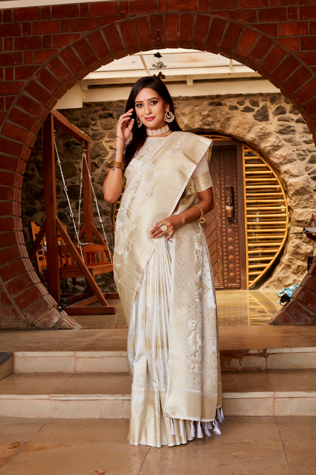 Beautiful white Kanjivaram satin silk saree with intricate weaving and a stunning woven pallu, perfect for making a grand entrance.