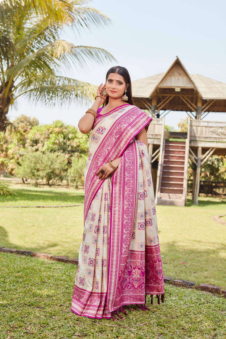 Traditional pale-pink Kanjivaram soft silk saree with detailed designer borders and timeless appeal.