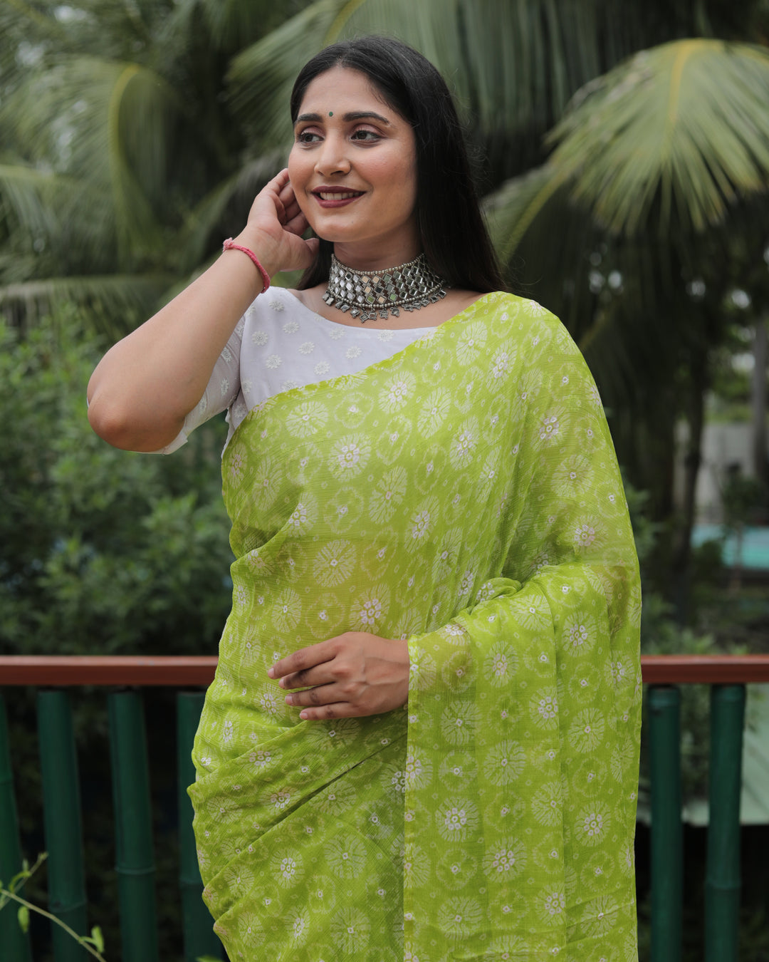 Soft light green chiffon saree with foil detailing, perfect for weddings and festive occasions.