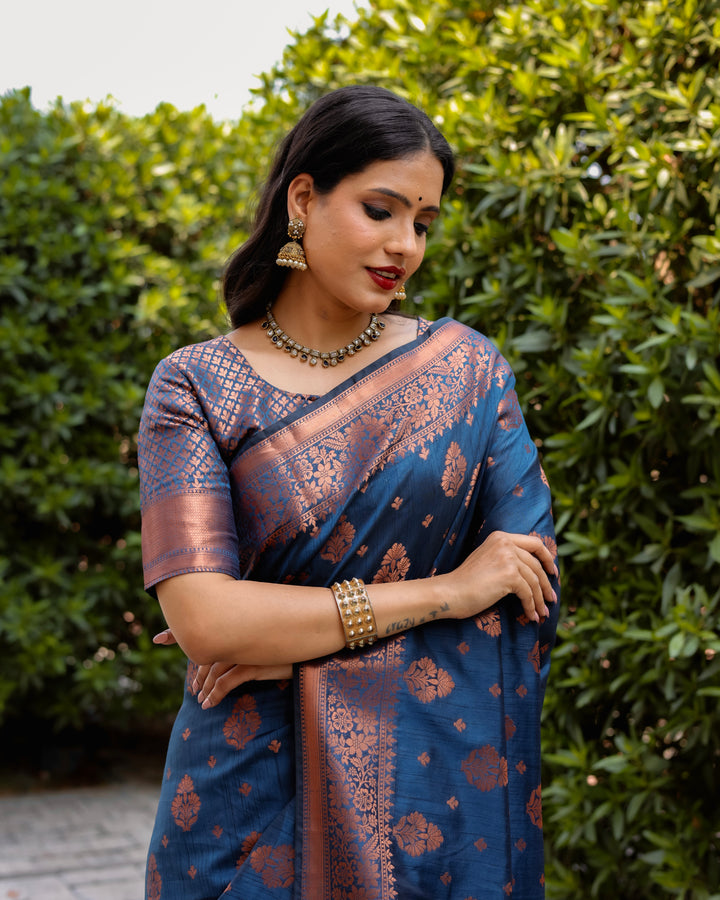 Elegant blue soft silk saree with rich copper work and a woven pallu, ideal for festive and special occasions.