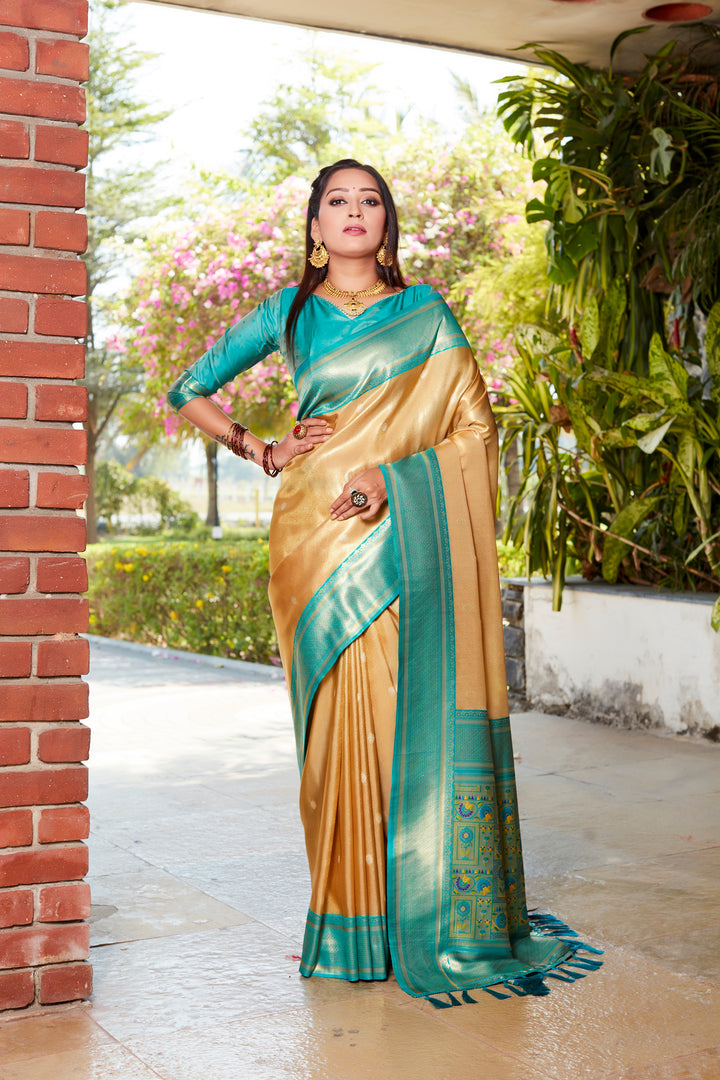 Stunning yellow tissue silk saree with rich pallu and contrasting blouse, perfect for festivals and ceremonies.