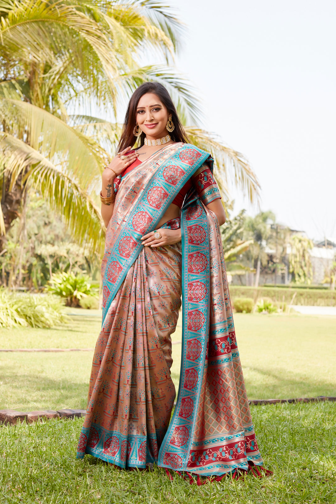 Soft peach Kanjivaram silk saree with detailed borders and intricate design, perfect for cultural celebrations.