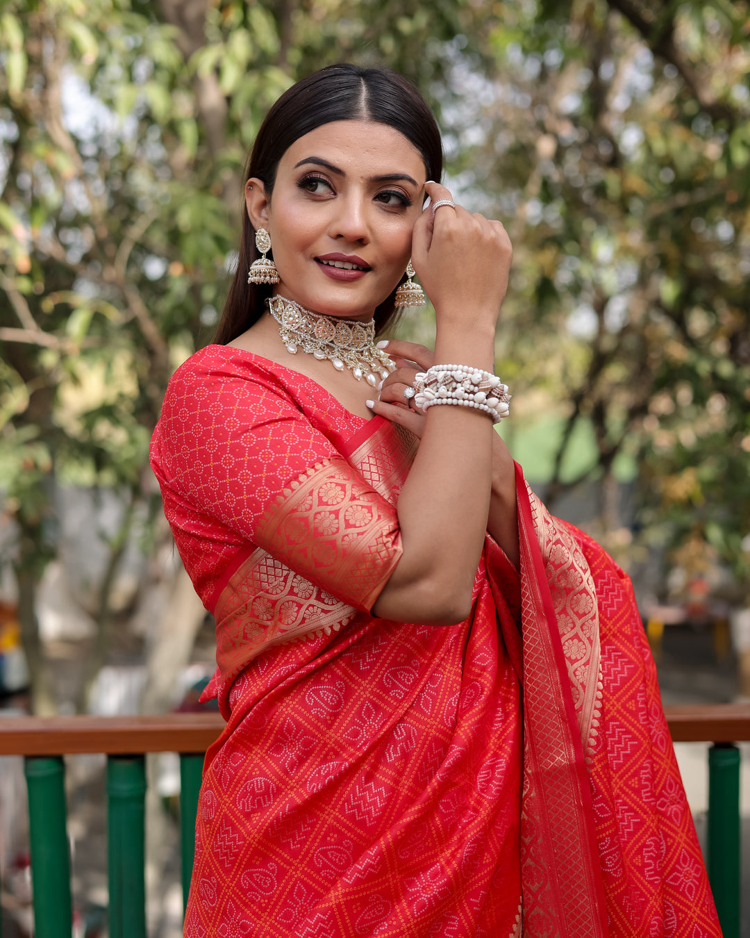 Traditional Indian saree in vibrant red featuring luxurious zari weaving and a rich pallu, perfect for cultural celebrations.