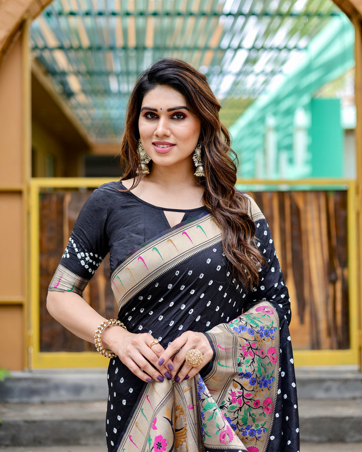 Black Bandhej silk saree with a Paithani border and zari work, paired with a rich pallu and matching tassels for a refined look.