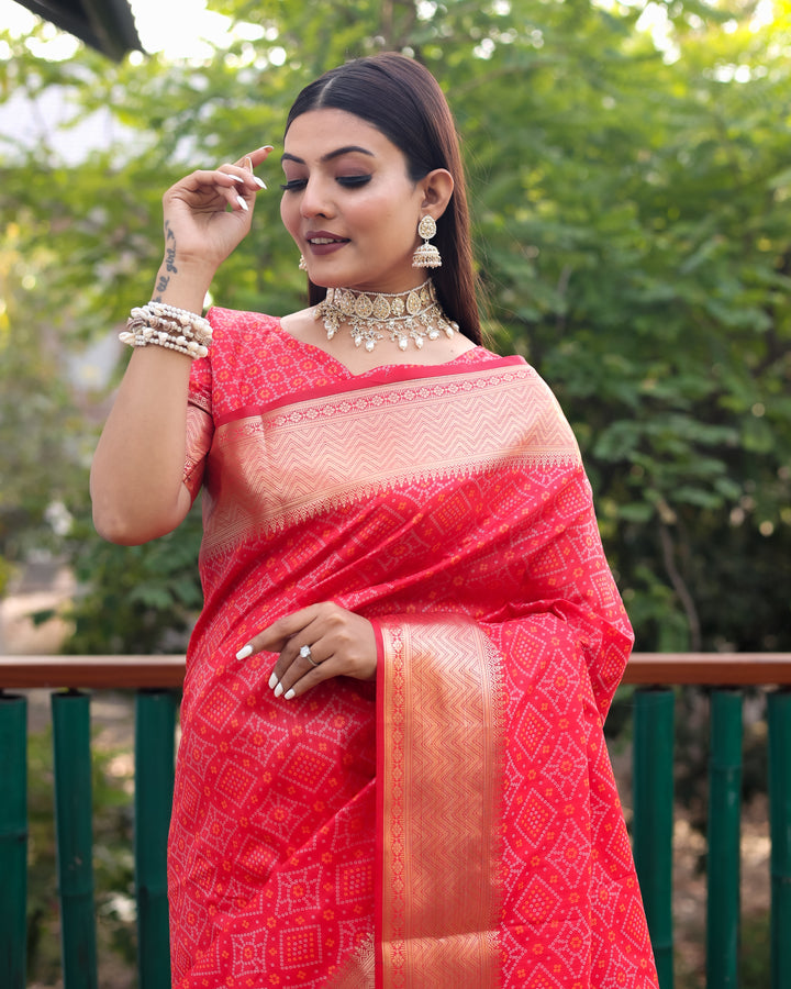 Elegant red saree showcasing exquisite Bandhej designs, complemented by beautifully woven kanchi borders.