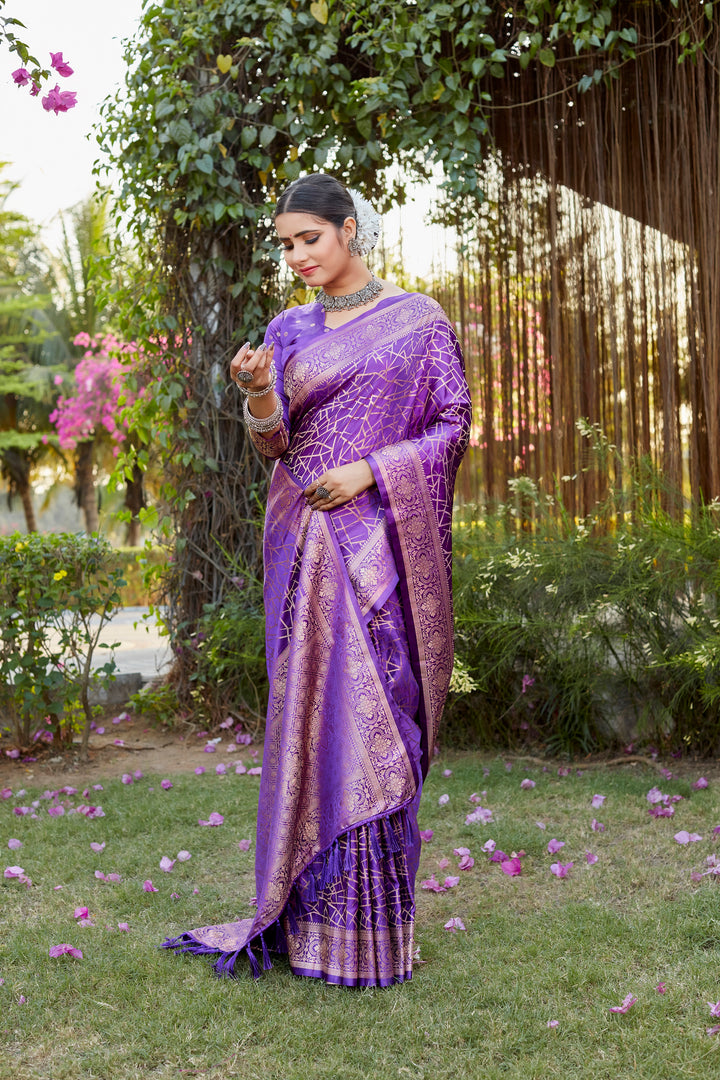 Elegant purple Kanjivaram soft satin silk saree with intricate butta design, perfect for weddings and grand celebrations.