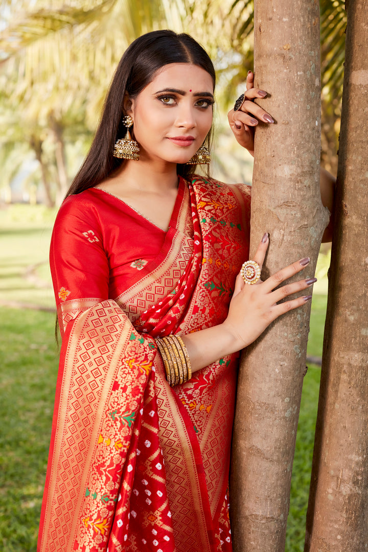 Gorgeous purple Gharchola Bandhej silk saree with intricate zari weaving and meenakari borders, ideal for bridal wear.