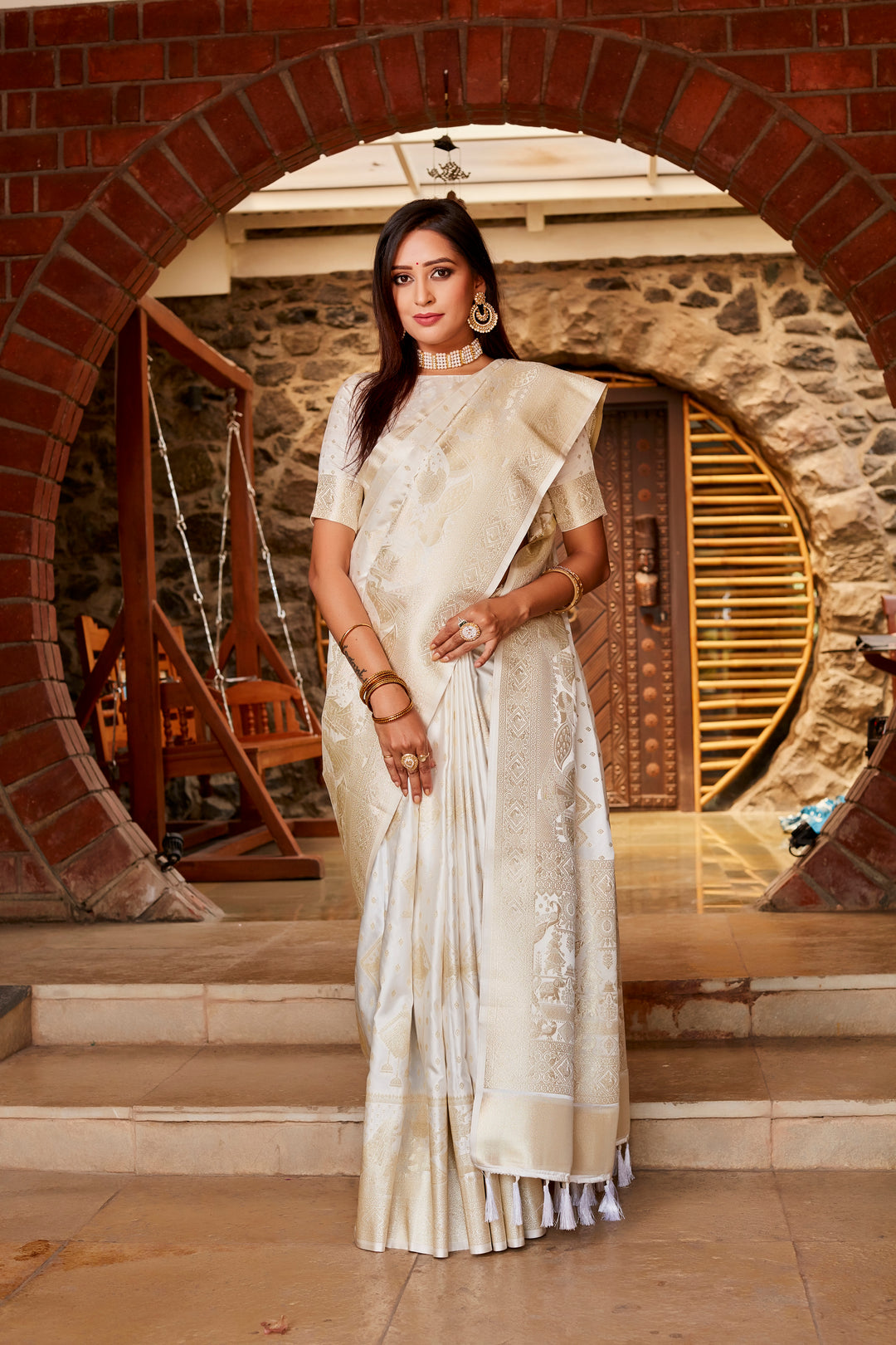 Timeless white Kanjivaram saree with soft satin fabric, designed with an elegant border and intricate detailing, ideal for weddings.