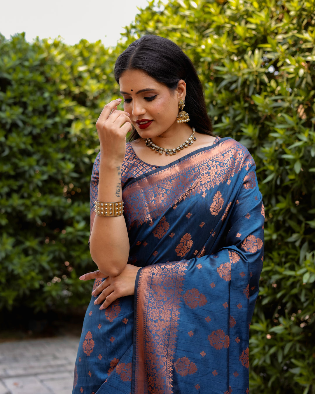 Stunning blue soft silk saree featuring intricate copper weaving and contrast borders, perfect for cultural celebrations.