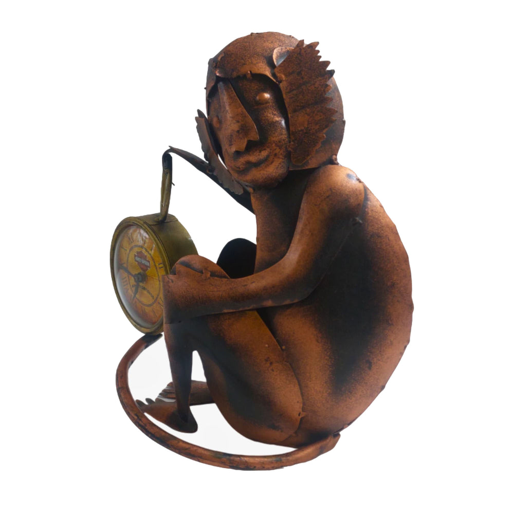 Decorative iron monkey sitting beside a clock, blending whimsy with practicality.