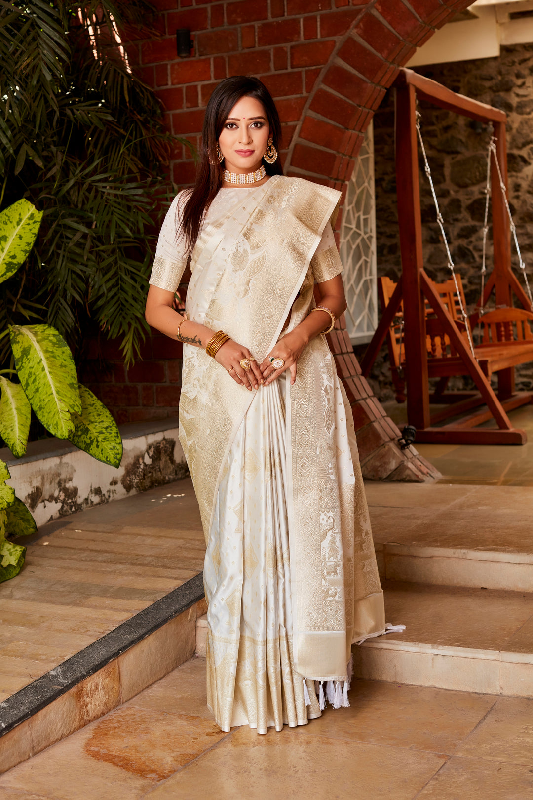 Graceful white Kanjivaram silk saree with shimmering finish, featuring a rich woven pallu and designer border, perfect for special occasions.