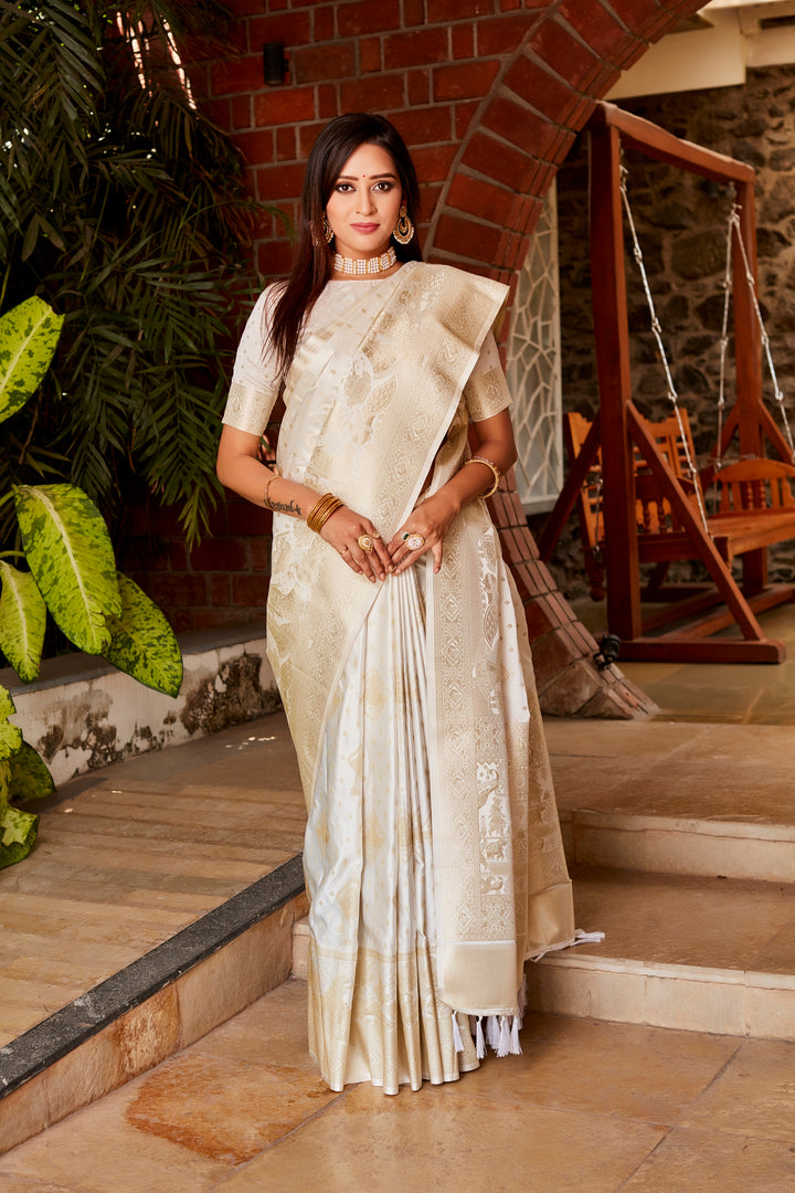 Graceful white Kanjivaram silk saree with shimmering finish, featuring a rich woven pallu and designer border, perfect for special occasions.