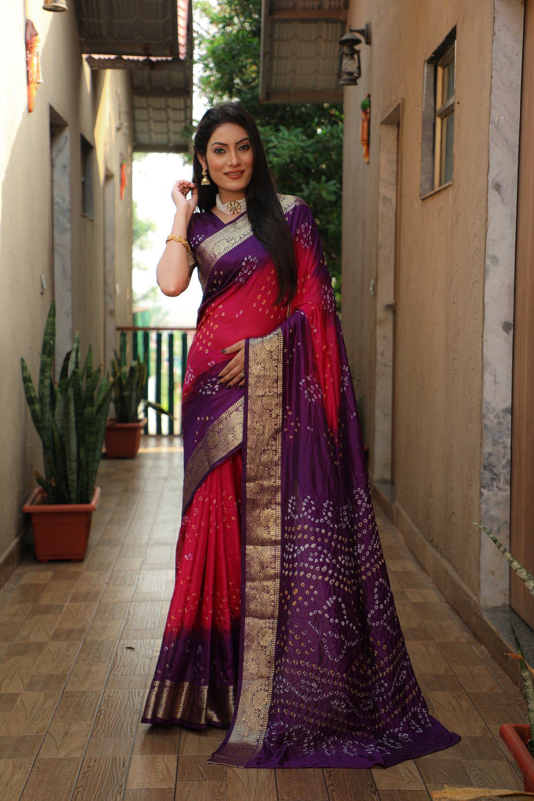 Elegant orange Bandhej Tapeta saree with intricate design, perfect for cultural celebrations.