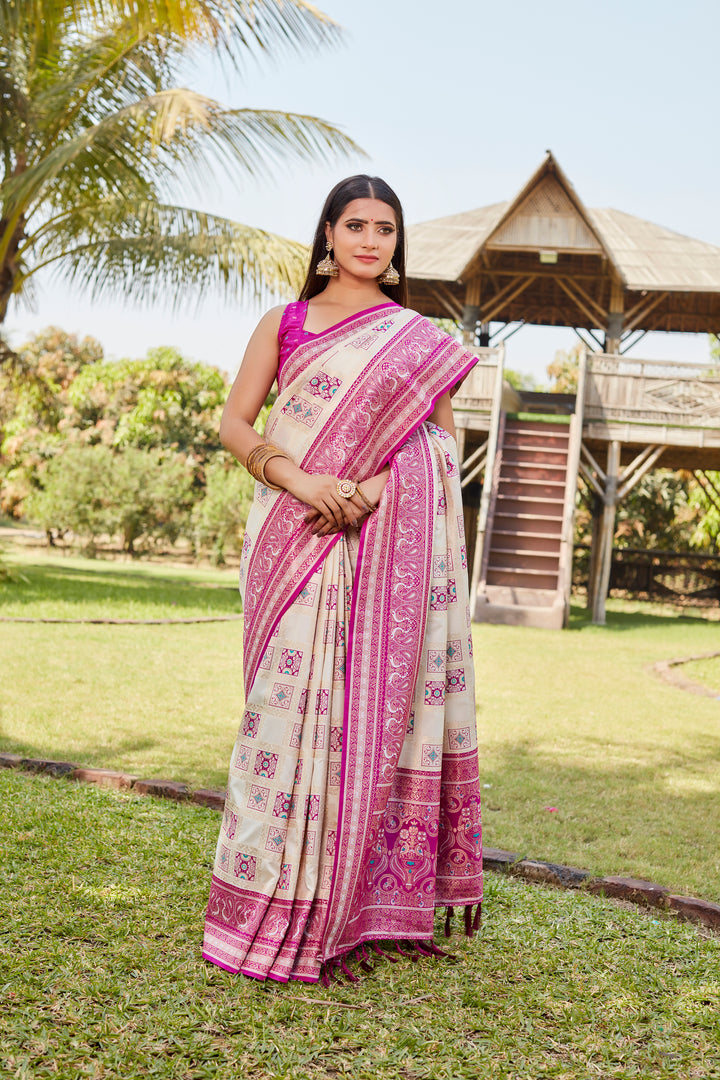 Classic pale-pink Kanjivaram soft silk saree with intricate designer borders and traditional patterns.