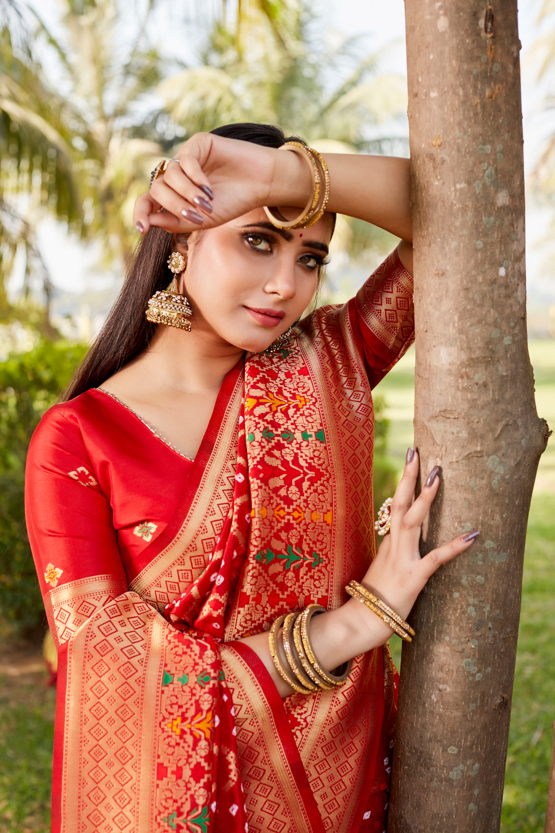 Exquisite purple Gharchola Bandhej silk saree with zari borders and meenakari detailing, perfect for traditional events.