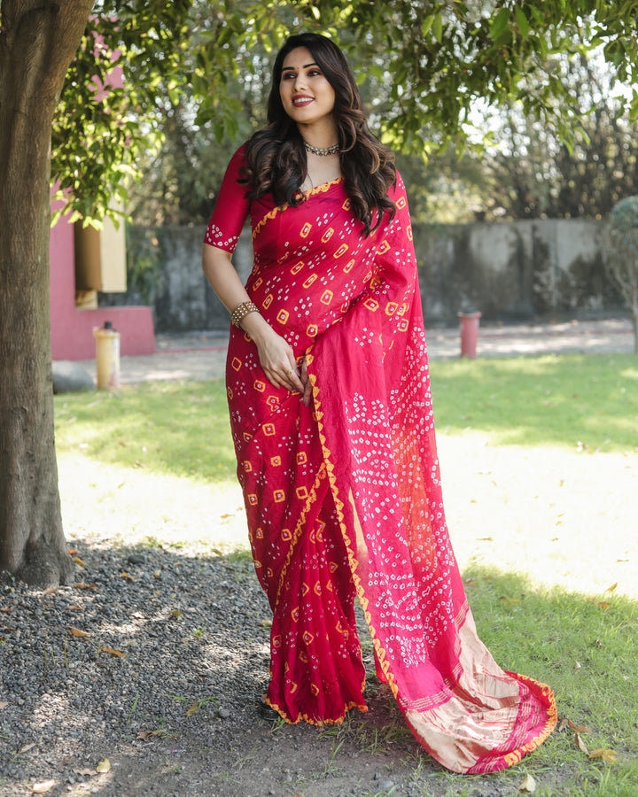 High-end Bandhej silk saree with intricate zari motifs and luxurious tissue pallu.