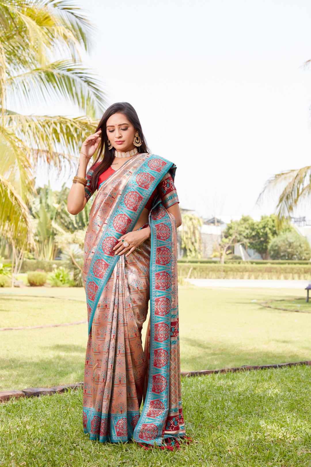 Elegant peach Kanjivaram saree with shimmering finish and woven pallu, perfect for weddings and formal occasions.