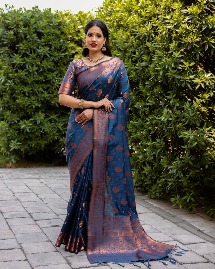 Traditional blue soft silk saree with a beautifully woven pallu and contrast copper borders, perfect for weddings.