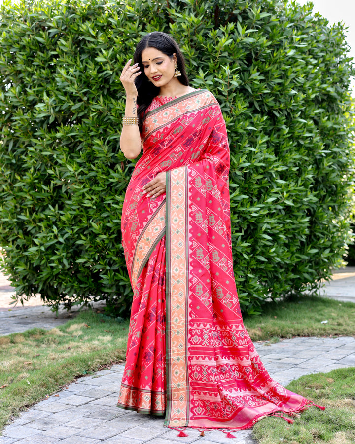 Elegant hot-pink Bandhej silk saree with zari woven pallu and matching blouse, perfect for bridal and festive occasions.