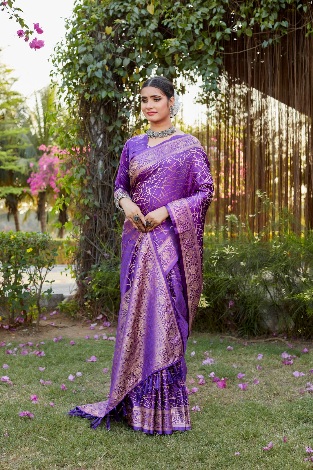 Beautiful purple Kanjivaram soft satin silk saree with intricate butta design, perfect for bridal and formal occasions.