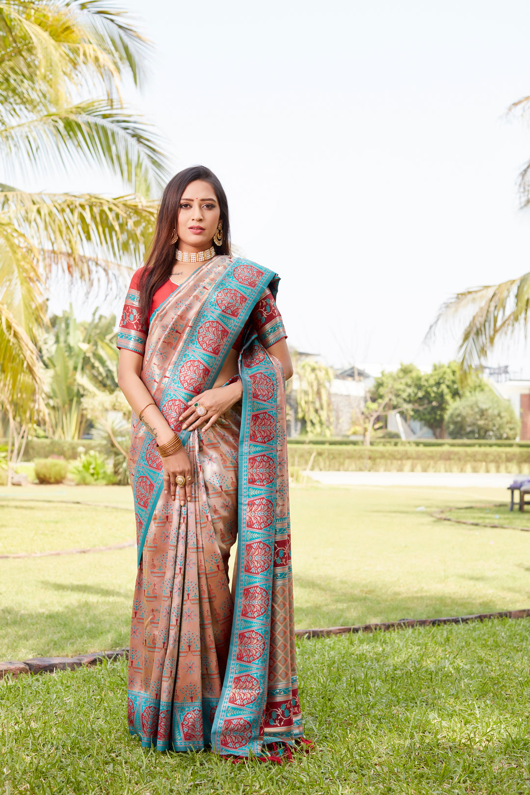 Beautiful peach Kanjivaram silk saree with intricate embroidery and zari borders, making it perfect for any celebration.