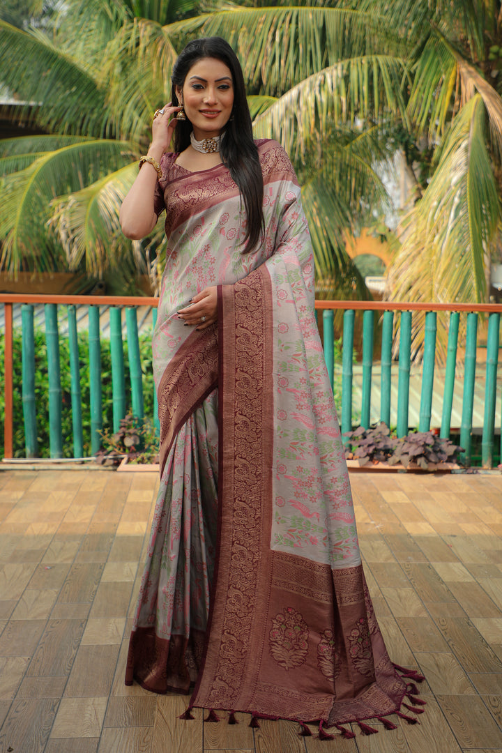 Beautiful grey Kanjivaram soft silk saree with intricate weaving and a heavy blouse, ideal for weddings and parties.