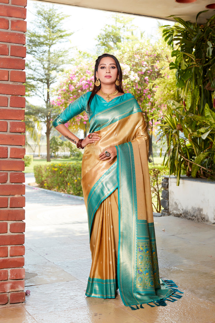 Elegant yellow tissue silk saree with a rich pallu and contrast blouse, perfect for grand events.