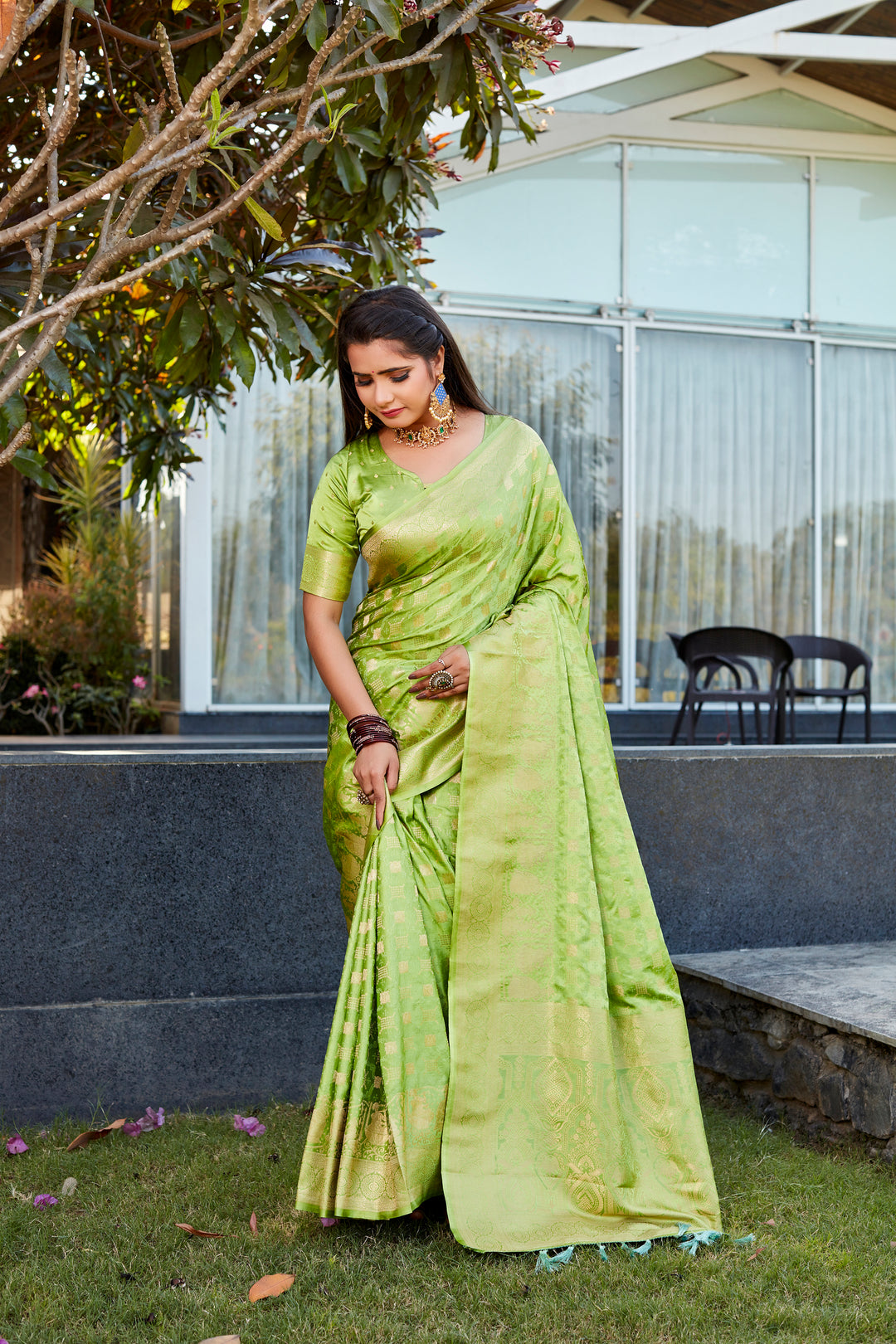 Premium Light-Green Satin Silk Saree with dual weave and exquisite pallu, ideal for festive celebrations.