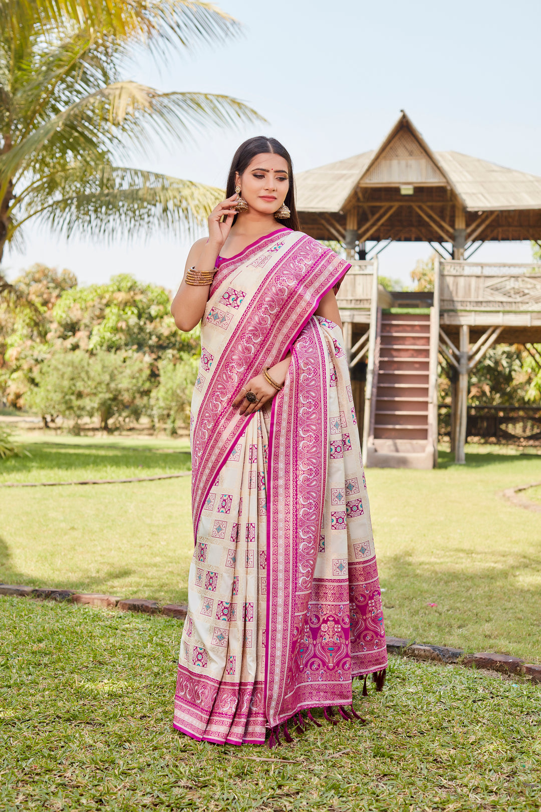 Beautiful pale-pink Kanjivaram soft silk saree with elegant designer borders and traditional craftsmanship.