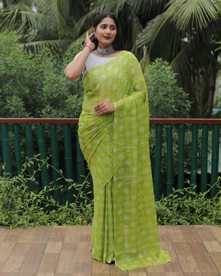 Beautiful light green chiffon saree with foil accents, perfect for elegant occasions and festive events.