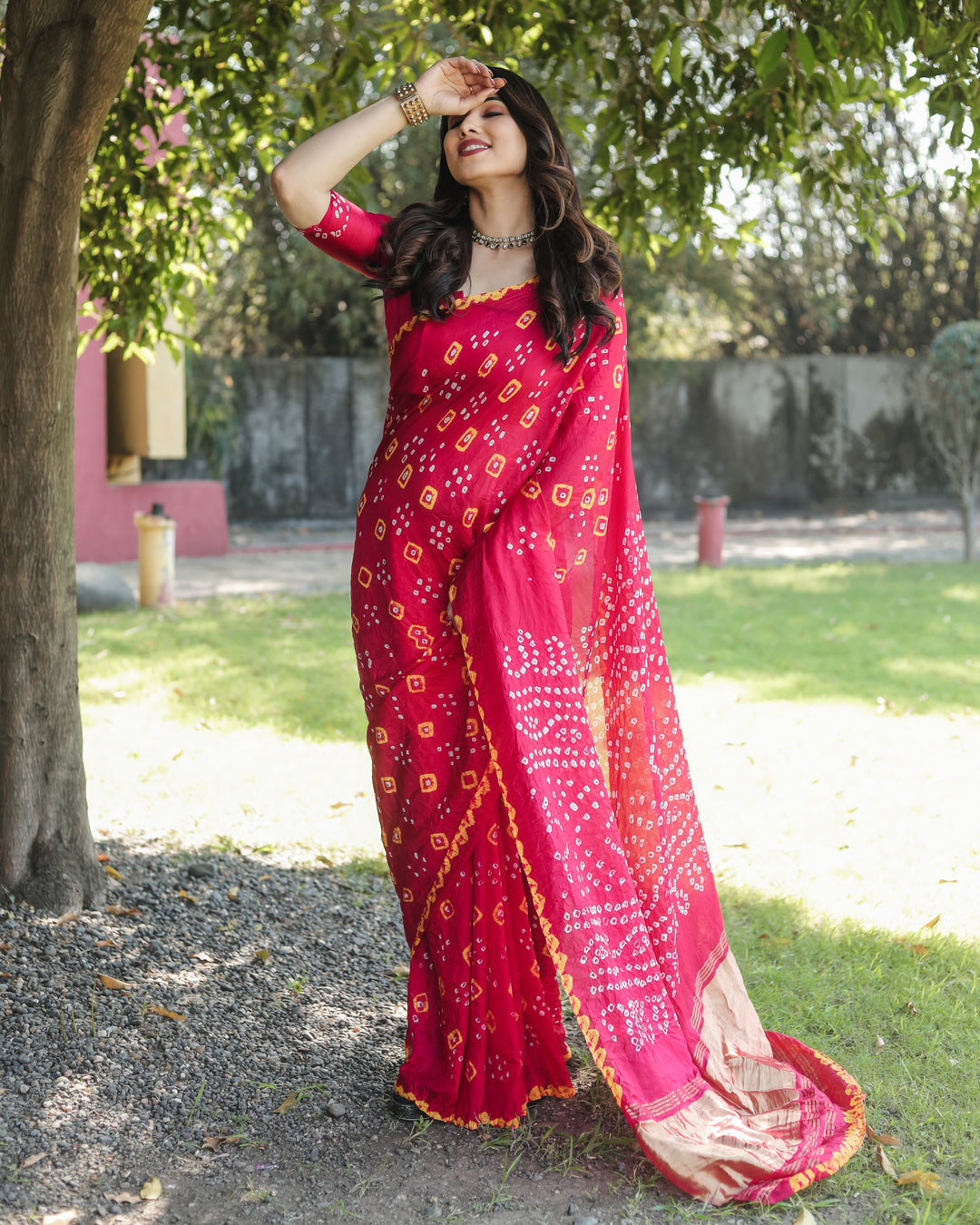 Designer Bandhej silk saree with luxury tissue pallu and exquisite zari details.