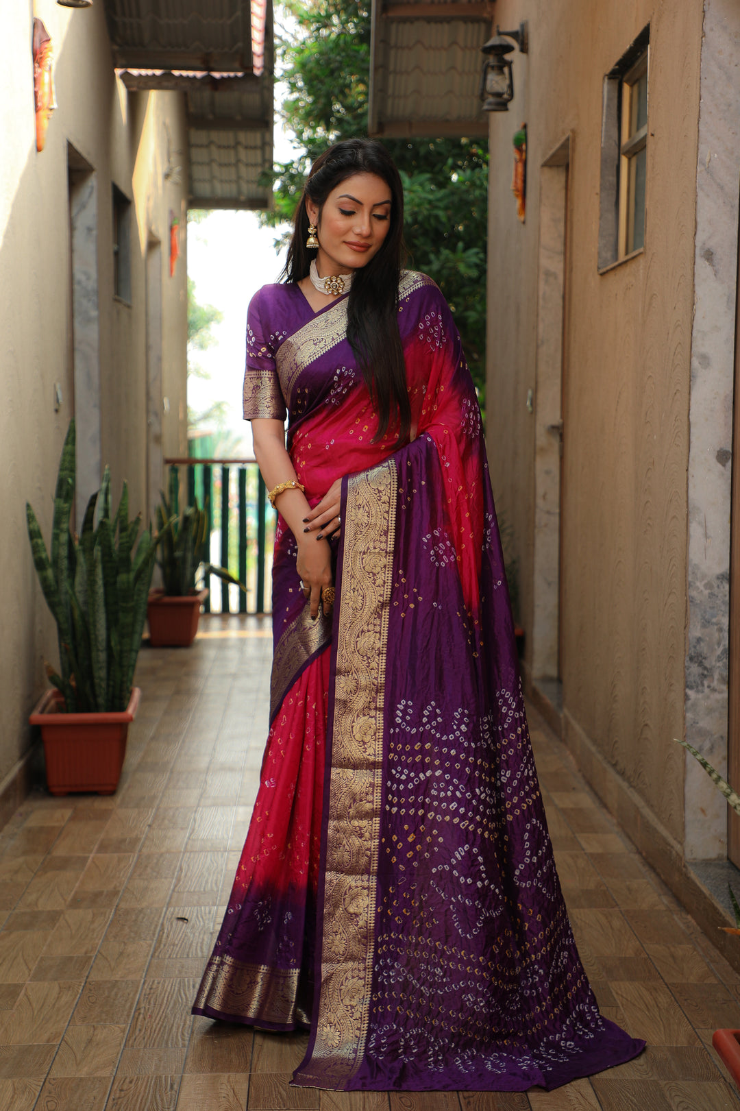 Stunning orange Bandhej Tapeta saree, offering timeless style for any occasion.