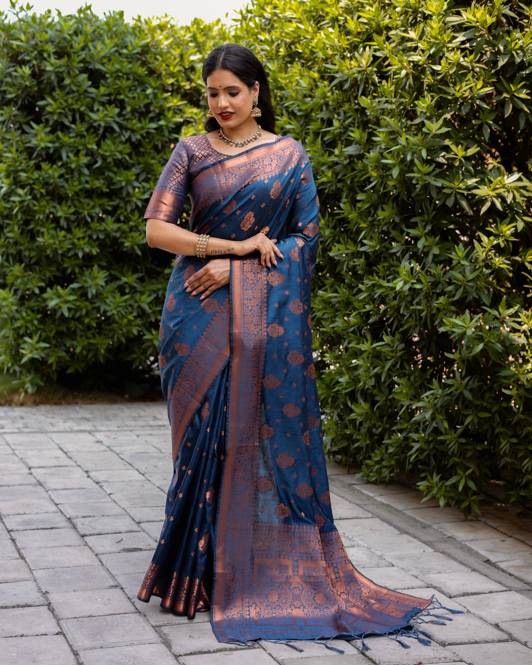 Sophisticated blue soft silk saree with copper body and contrast borders, ideal for special gatherings and celebrations.