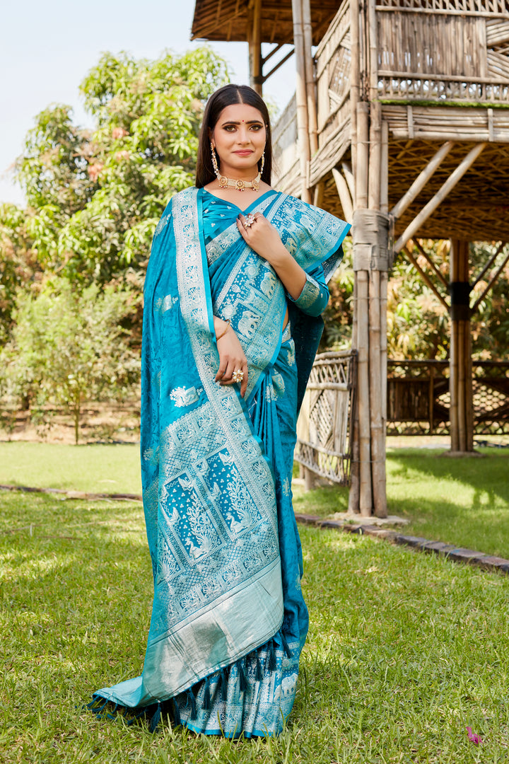 Exquisite sky blue satin Kanjivaram saree with intricate elephant border details, perfect for traditional events.