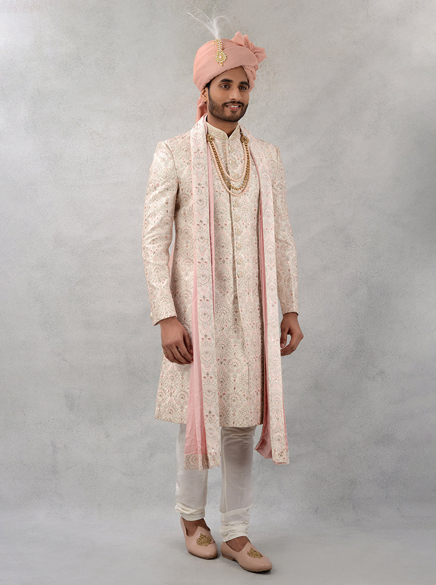 Elevate your wedding style with this exquisite cream and gold sherwani, blending tradition with modern elegance.