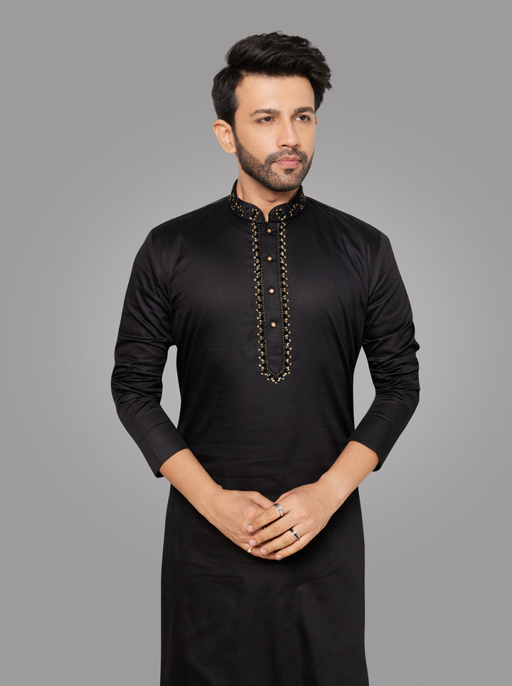 Celebrate in style with our black silk blend kurta pajama, tailored for comfort and luxury.