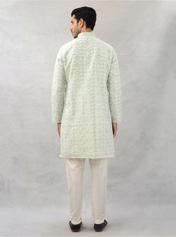 Men’s pista green kurta pajama set with luxurious silk jacquard fabric for traditional events.