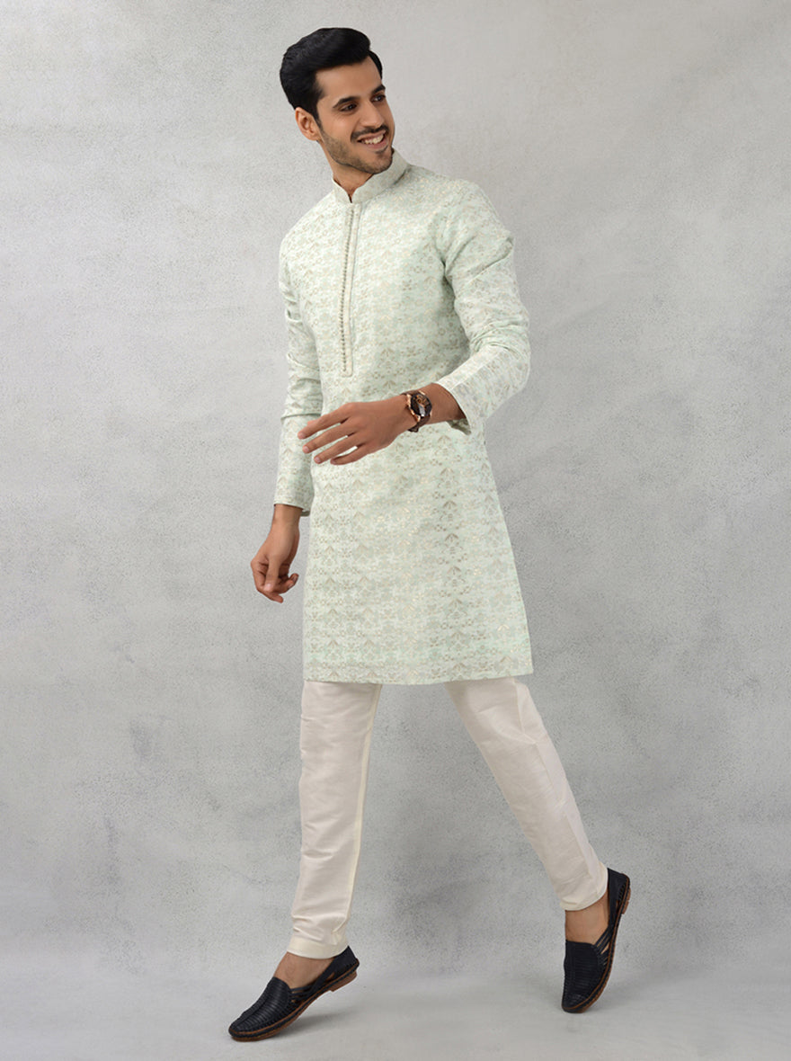 Stylish pista green kurta pajama set in silk jacquard fabric, perfect for festivals and weddings.