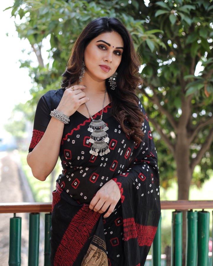 Black Bandhej silk saree with a beautiful tissue pallu and zari details, ideal for weddings and festive celebrations.