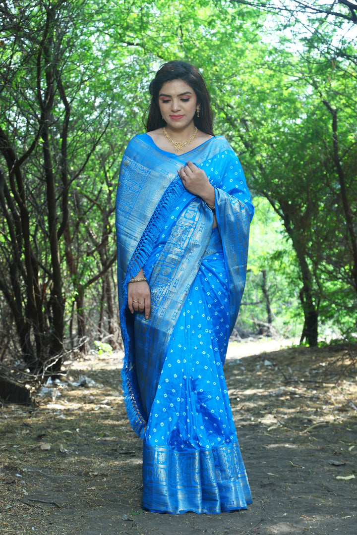 Gorgeous blue handmade Bandhej Kanjivaram silk saree with intricate Bandhej design and stunning border and pallu.