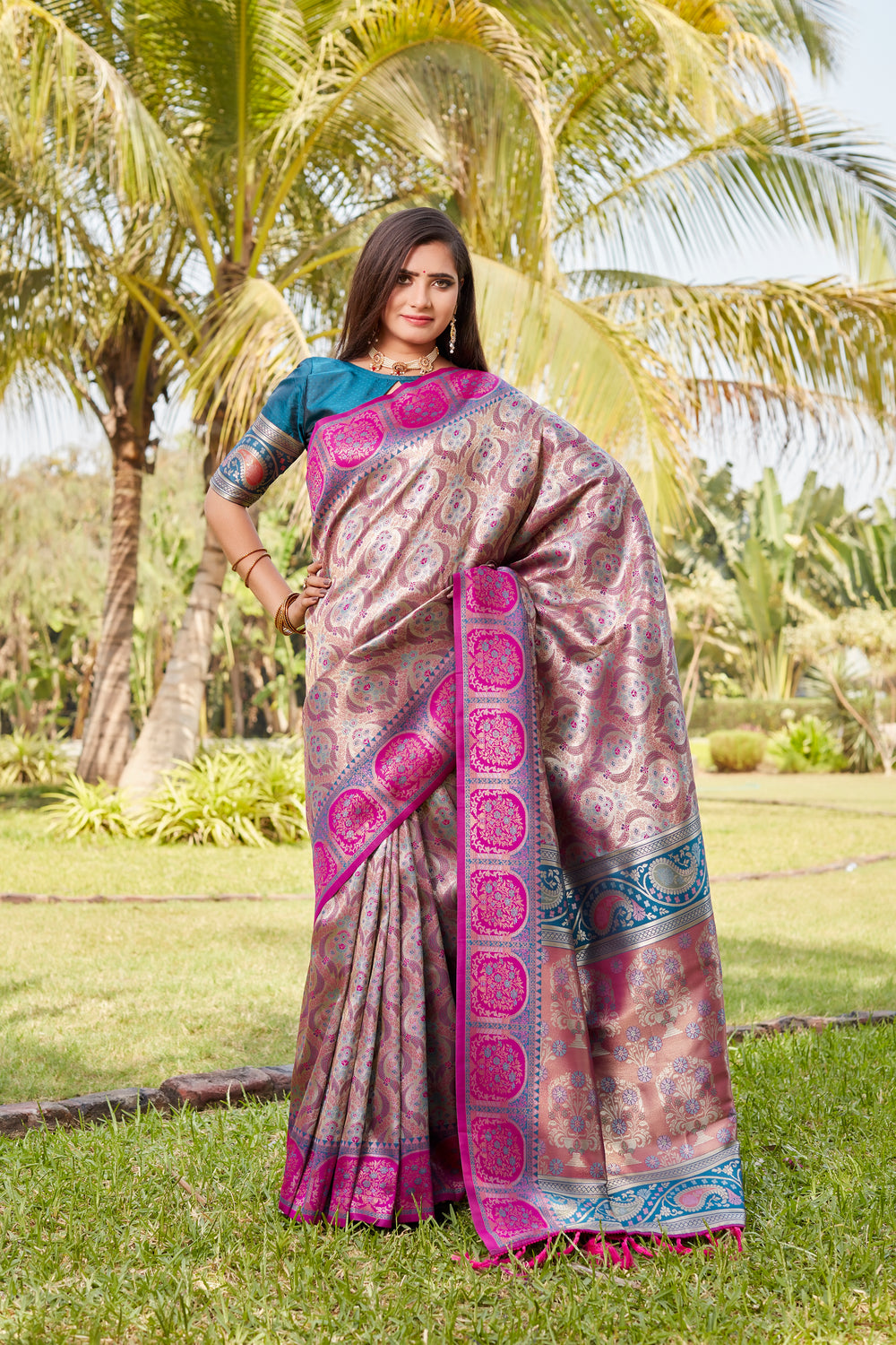 Timeless bright-pink Kanjivaram soft silk saree with rich pallu and intricate work for grand celebrations.