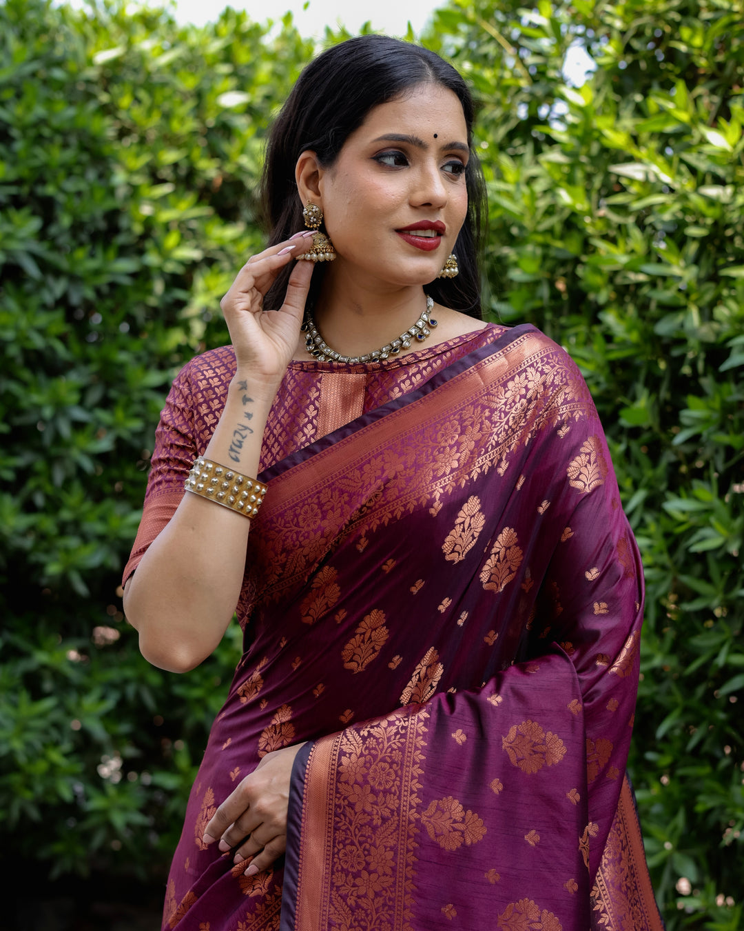 Rich purple soft silk saree featuring a beautiful copper body, contrast border, and a sophisticated woven pallu.