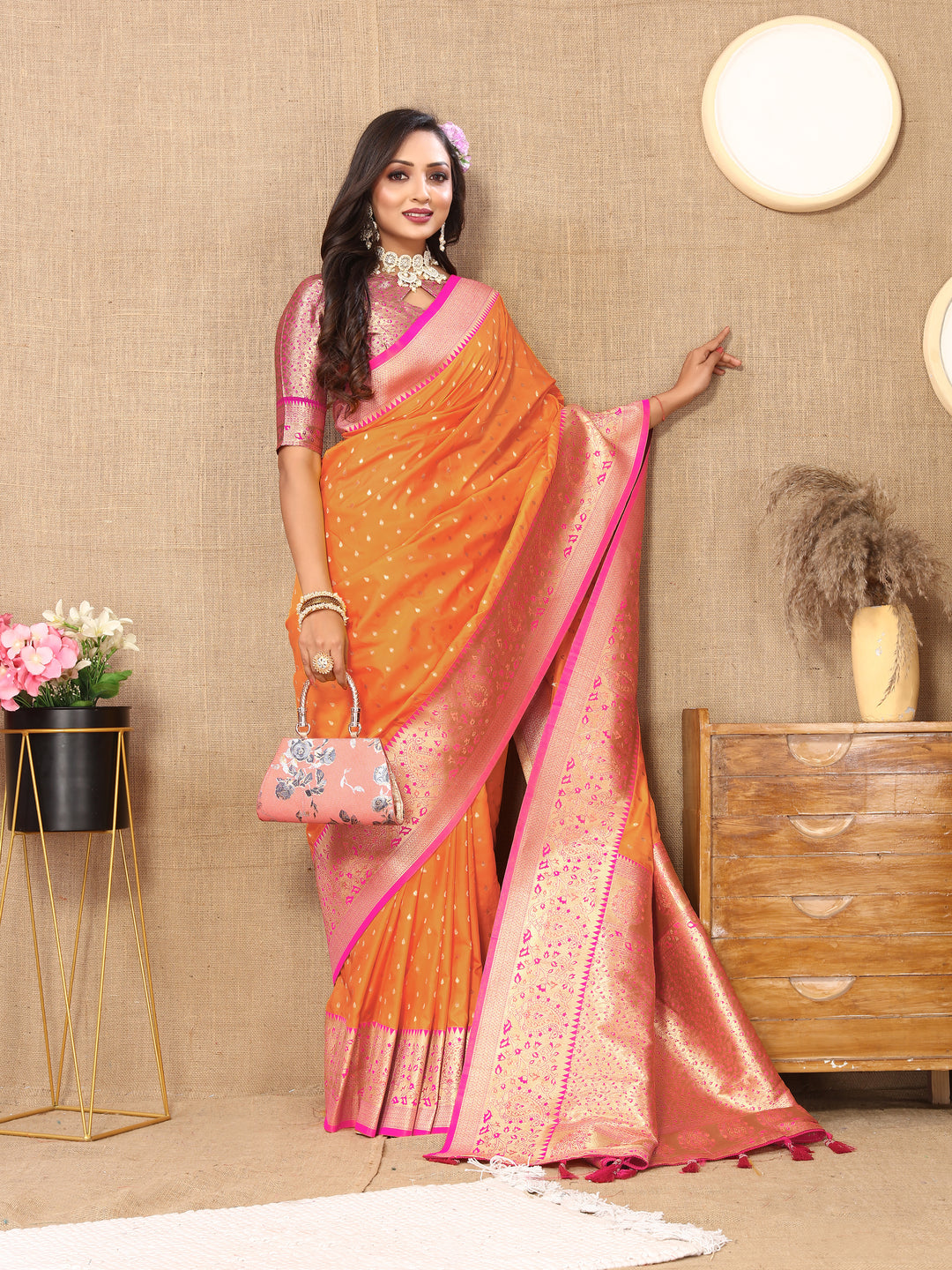 Vibrant Orange Soft Silk Saree with intricate zari weaving and a luxurious brocade blouse.