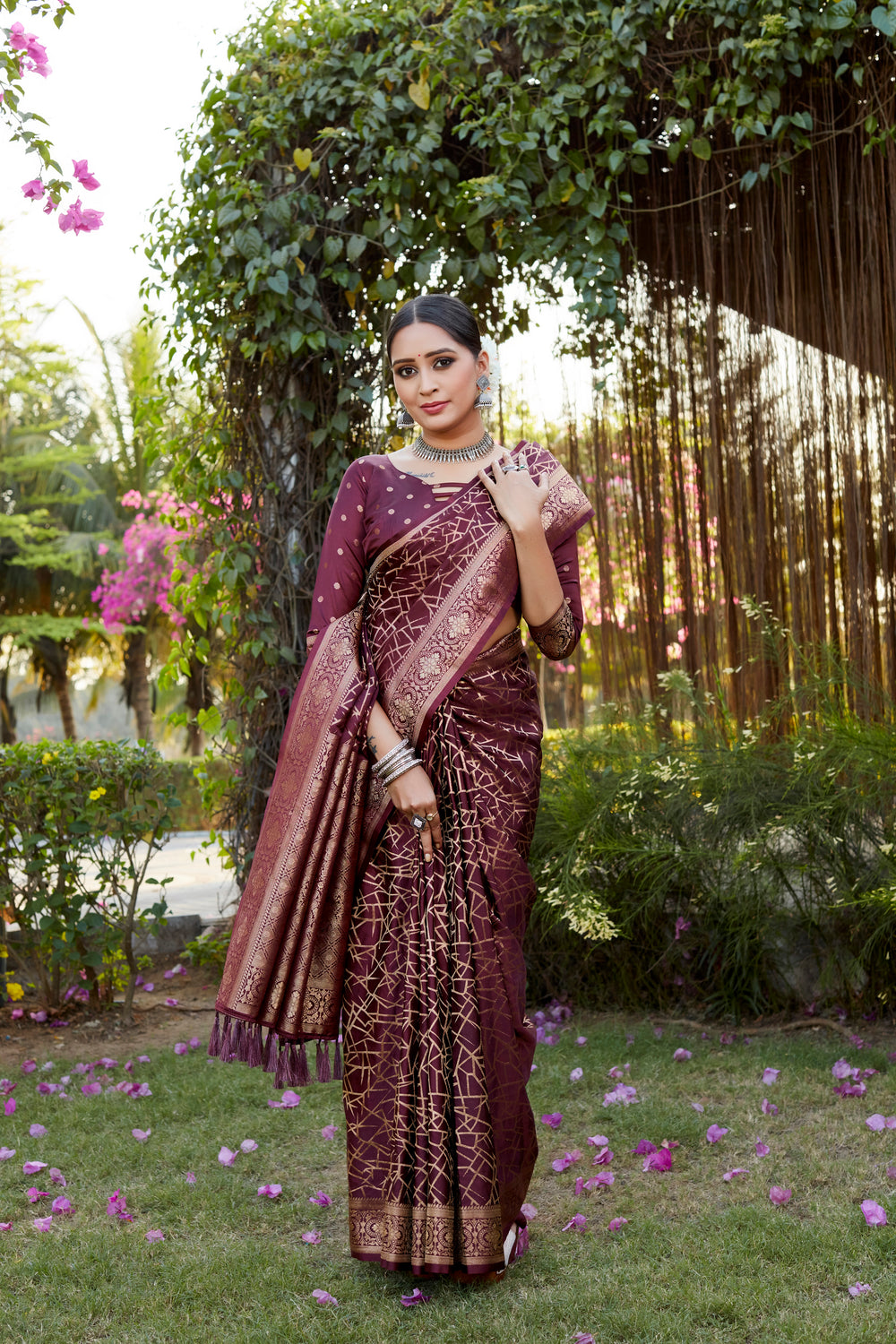 Stunning wine Kanjivaram soft satin silk saree with intricate weaving and butta design, ideal for traditional celebrations.