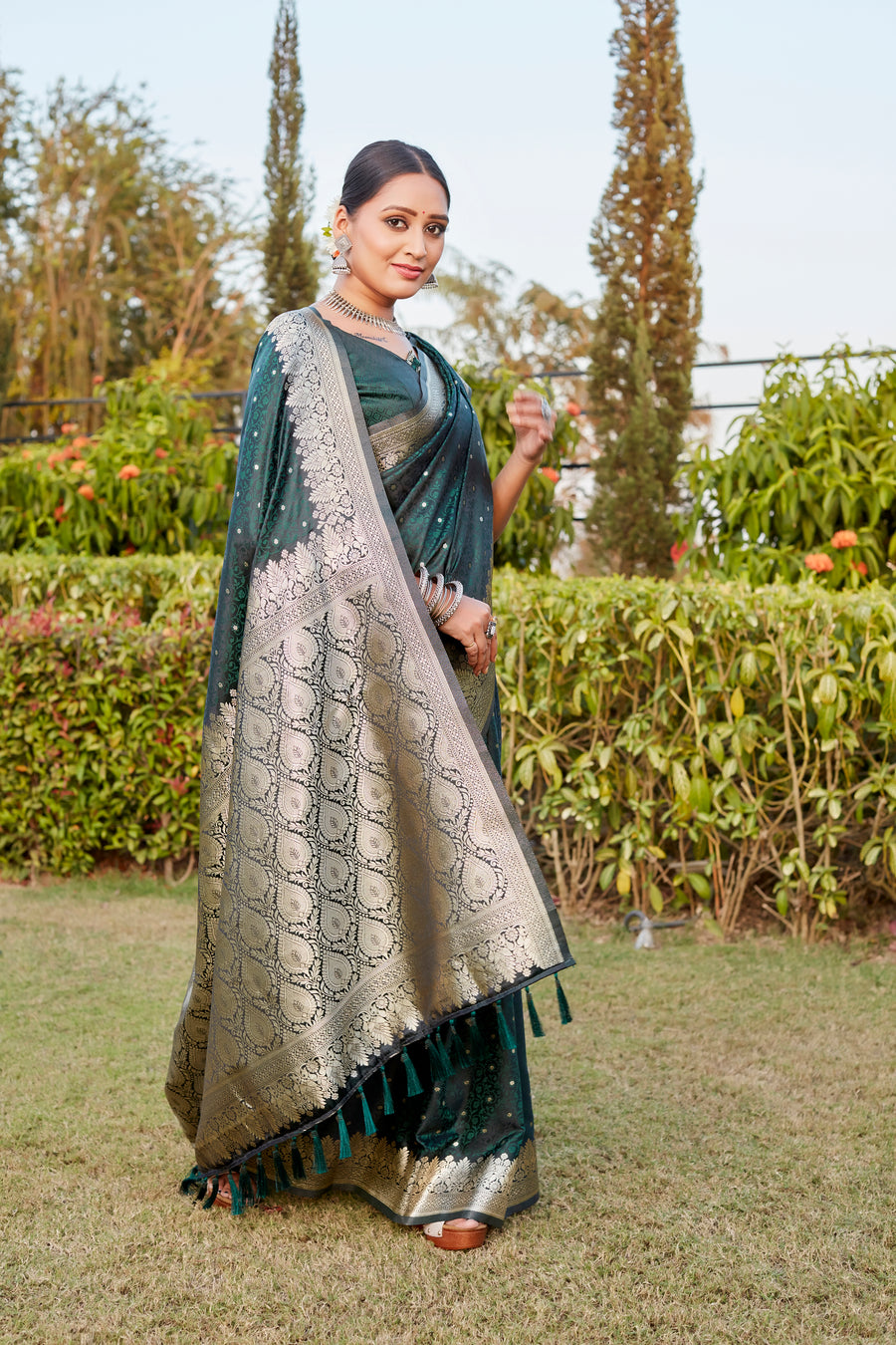 Dark-Green Royal Kanjivaram Satin Silk Saree with intricate Butta design and elegant designer border.