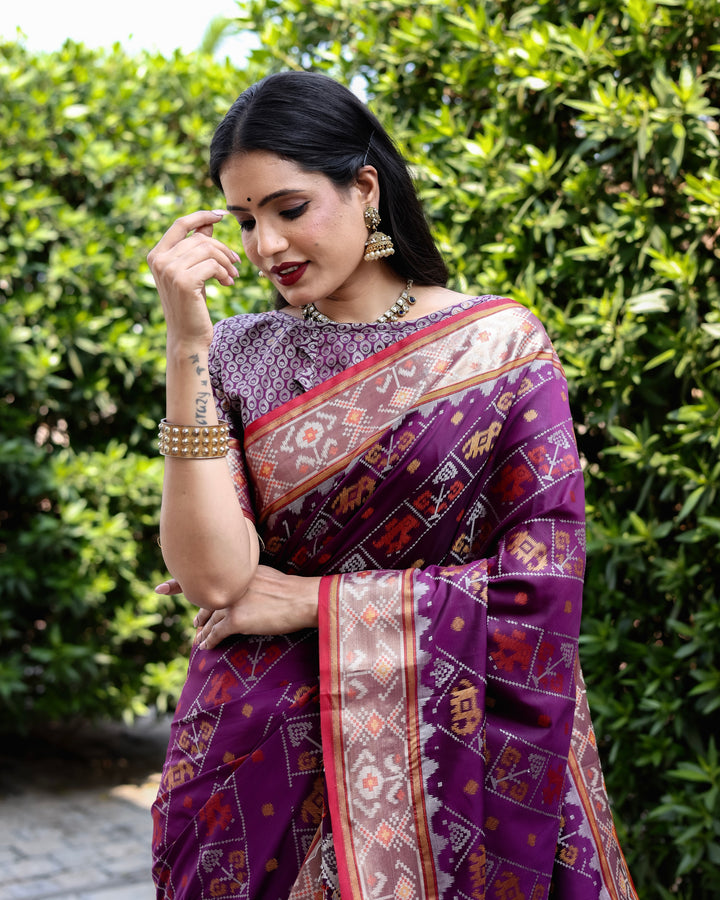 Stunning purple Bandhej silk saree with zari woven pallu and matching blouse, perfect for bridal wear.