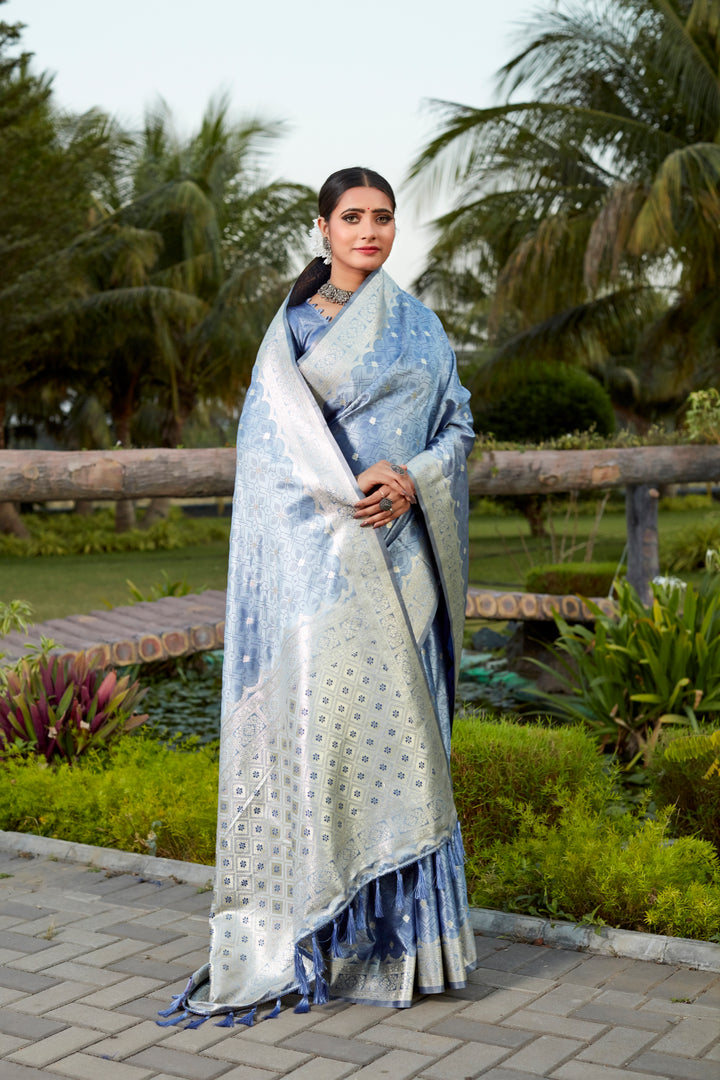 Gorgeous blue Kanjivaram silk saree with intricate butta work and designer border, ideal for bridal wear.