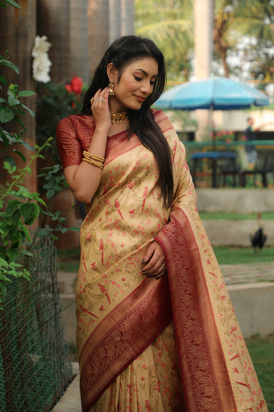 Traditional Indian saree in beige, crafted with Kanjivaram silk for a stunning shine, perfect for weddings and festive celebrations.