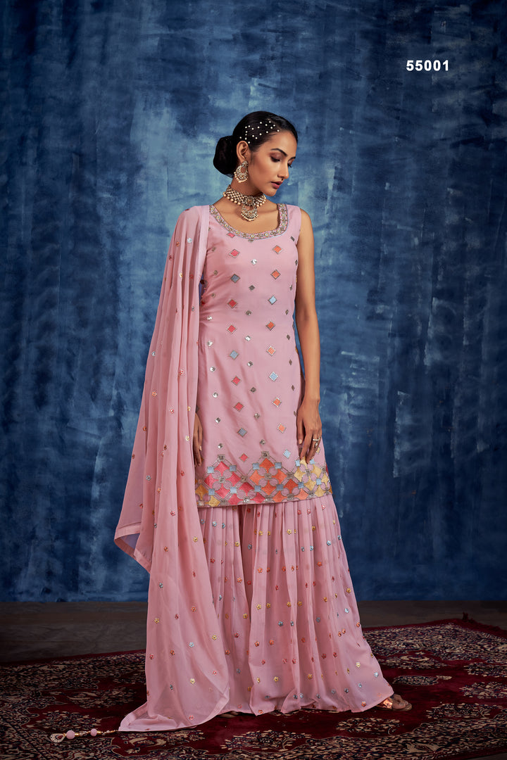 Embroidered baby pink sharara with pleated palazzo and santoon lining for wedding events.